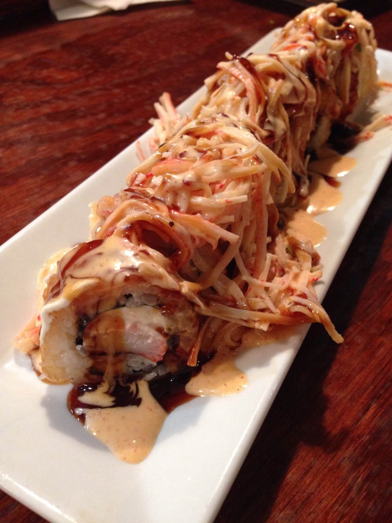 Nippers - Jax beach crawler tempura fried roll, spicy krab salad, cream cheese, shrimp sauce, sriracha, sweet soy reduction